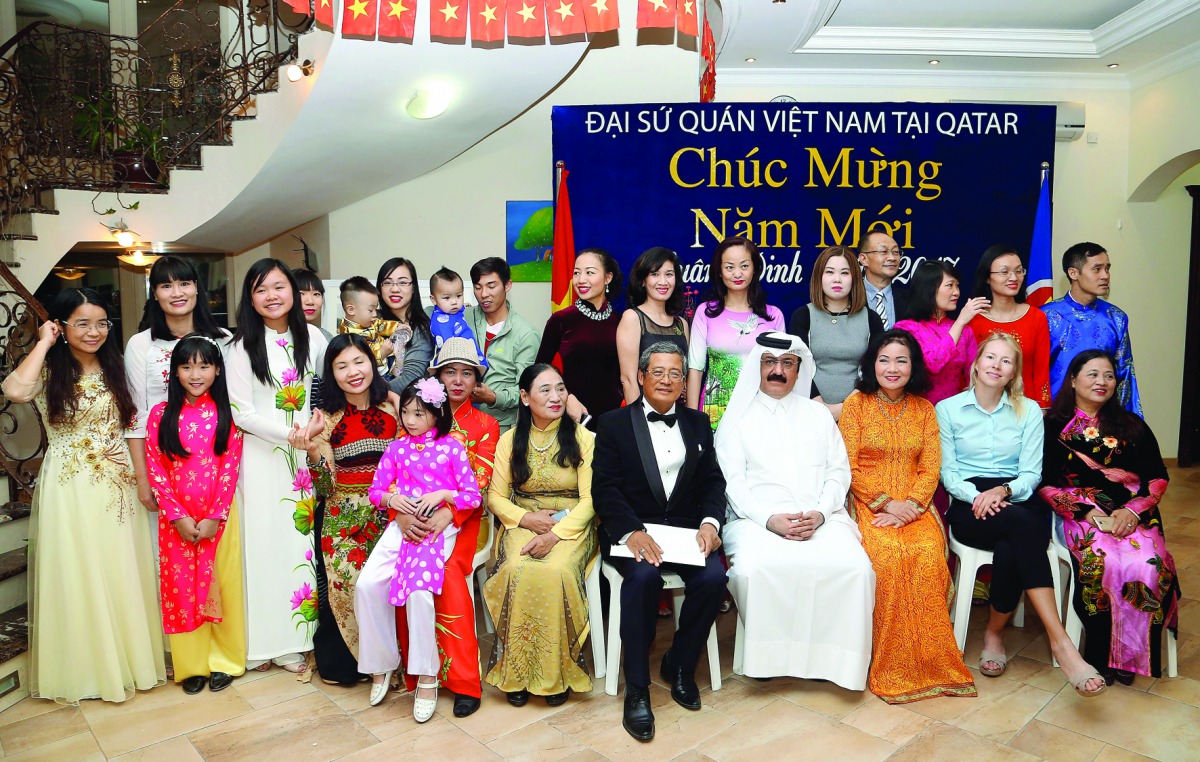 Vietnam Ambassador Nguyen Hoang (fifth right) with community members and guests on the celebration of Vietnamese Lunar New Year at his residence yesterday. Pic: Abdul Basit / The Peninsula 