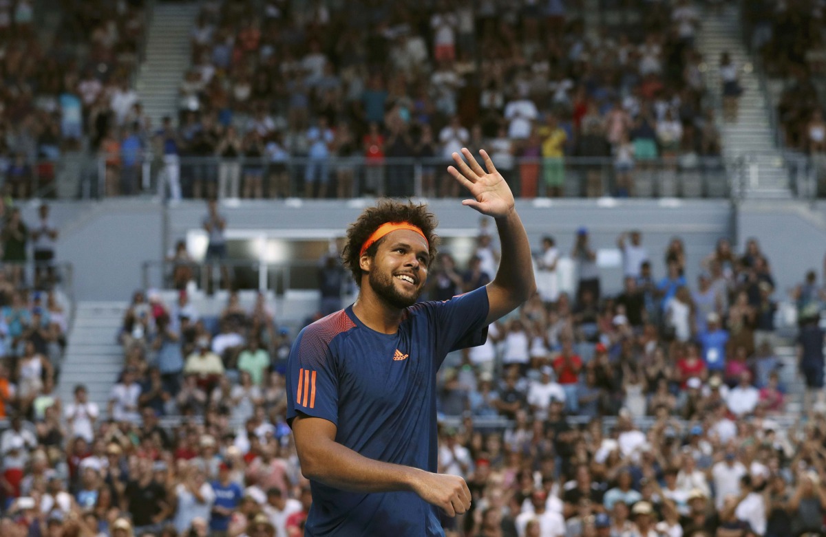 France's Jo-Wilfried Tsonga waves after winning his Men's singles fourth round match against Britain's Daniel Evans. (REUTERS/Edgar Su)