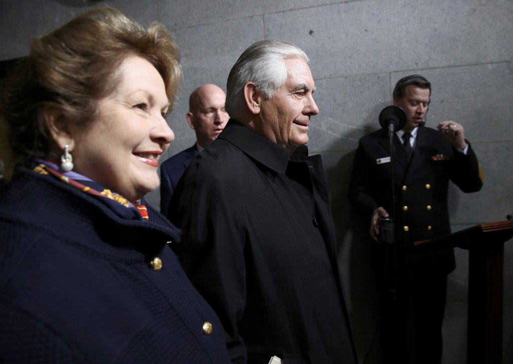 Donald Trump's Secretary of State Rex Tillerson (R) and his wife Renda Tillerson arrive on the West Front of the U.S. Capitol in Washington, D.C., U.S., January 20, 2017. REUTERS/Win McNamee/Pool
