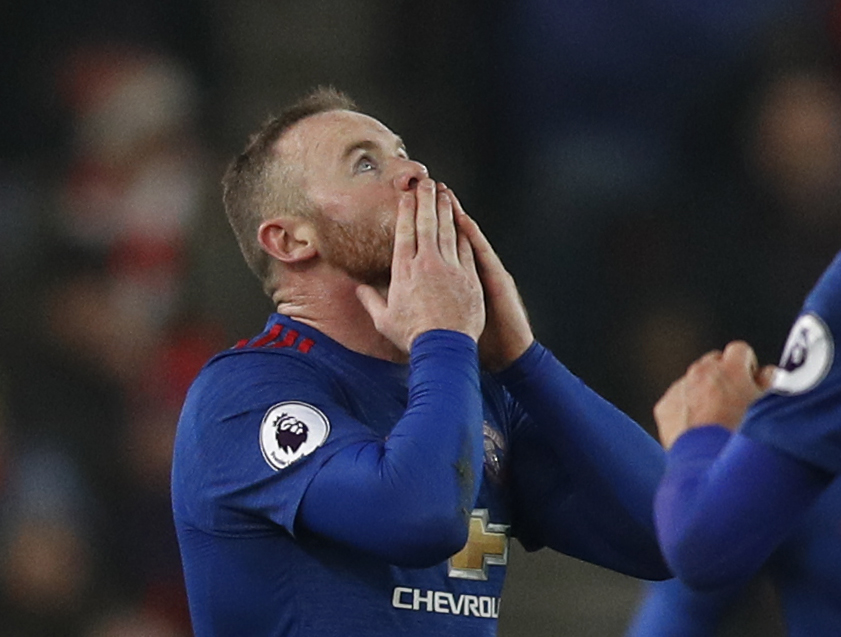 Manchester United's Wayne Rooney celebrates after scoring their first goal to break the all time goalscoring record for Manchester United Reuters / Darren Staples