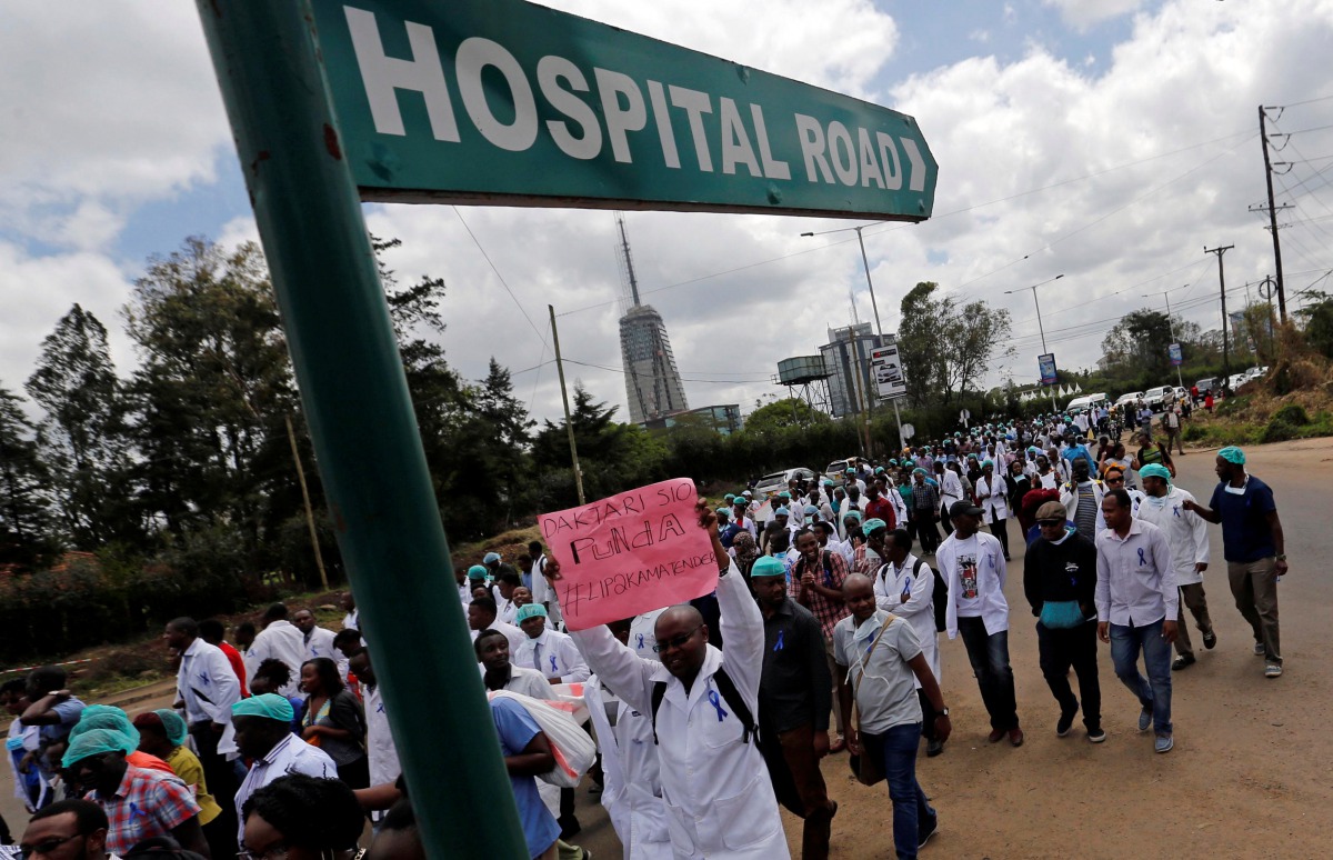 Kenyan doctors march during a strike to demand fulfilment of a 2013 agreement between their union and the government that would raise their pay and improve working conditions in Nairobi, Kenya. Photo: Reuters / Thomas Mukoya