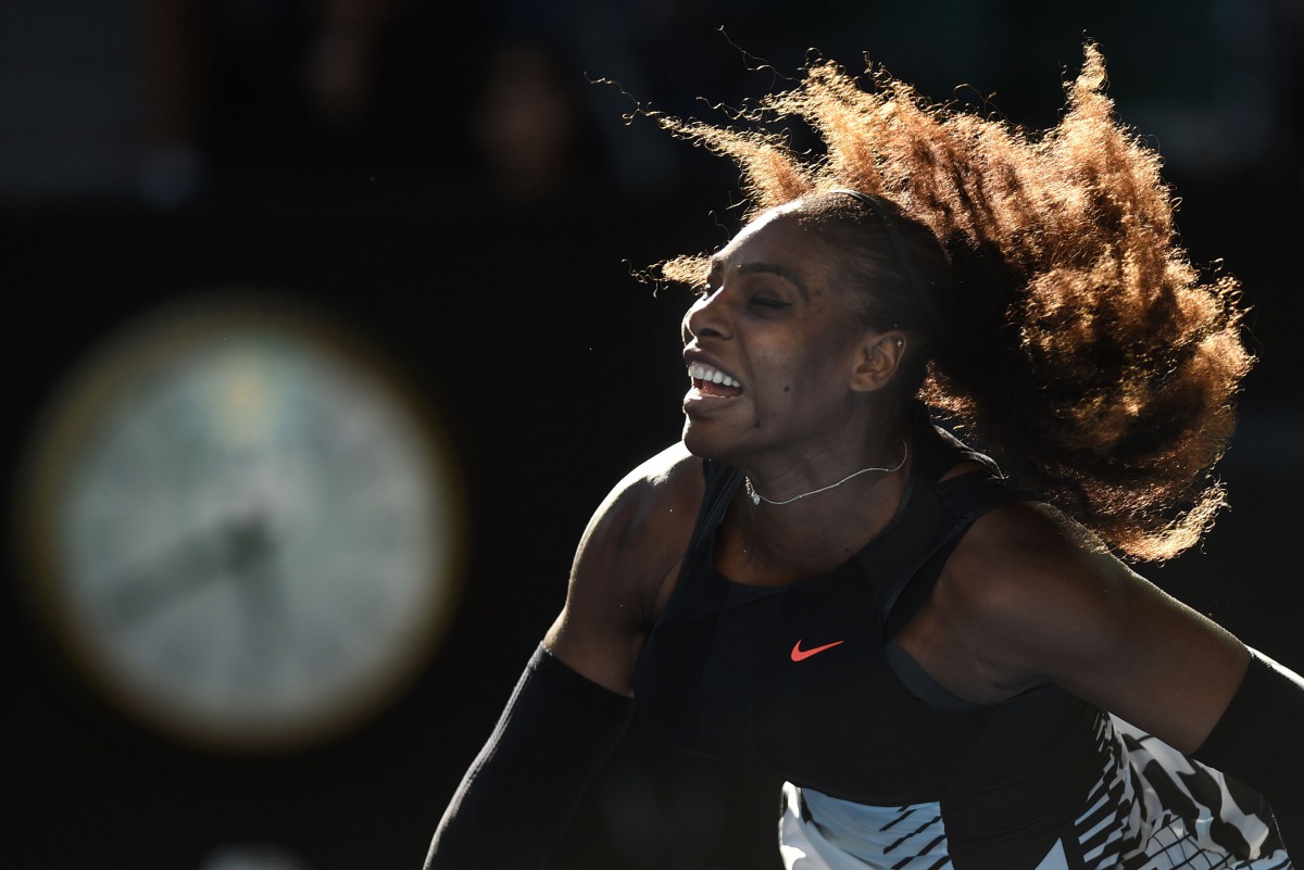 Serena Williams of the US serves against Croatia's Mirjana Lucic-Baroni during their women's singles semi-final match on day 11 of the Australian Open tennis tournament in Melbourne on January 26, 2017. (AFP / SAEED KHAN)