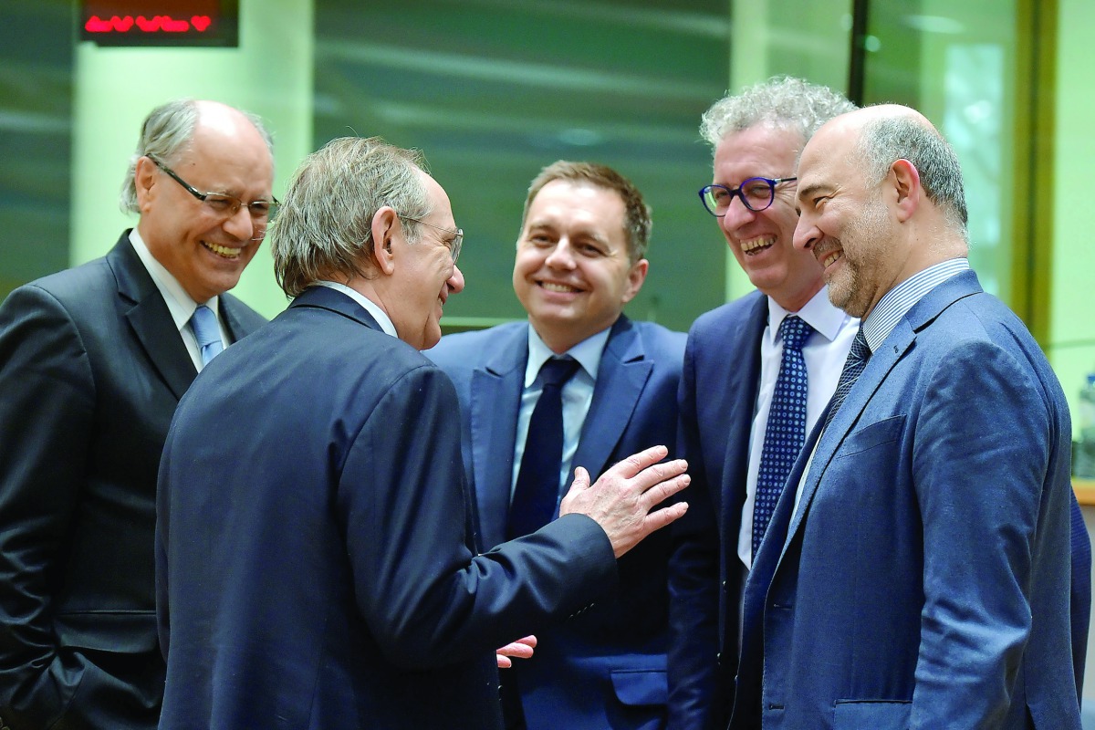 Malta's Finance Minister Edward Scicluna, Italy's Finance Minister Pier Carlo Padoan, Slovakia's Finance Minister Peter Kazimir, Luxembourg's Finance Minister Pierre Gramegna and European Economic and Financial Affairs Commissioner Pierre Moscovici (L-R) 