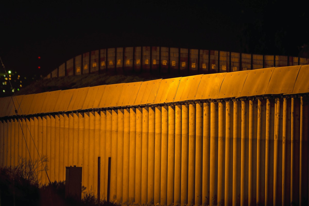 Multiple layers of steel walls, fences, razor wire and other barricades are seen on the US- Mexico border in San Ysidro, California, yesterday.