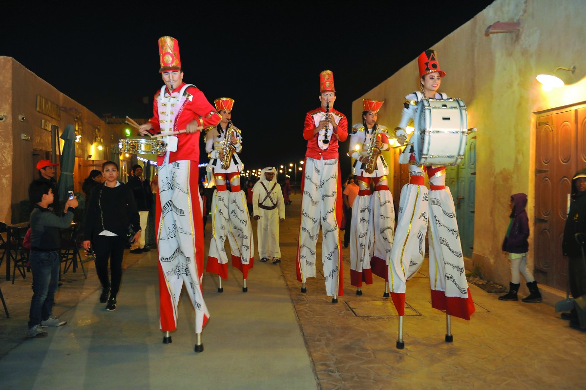 Stilt walkers entertain visitors at Wakrah Souq during the Spring Festival, yesterday. Pic: Abdul Basit/The Peninsula