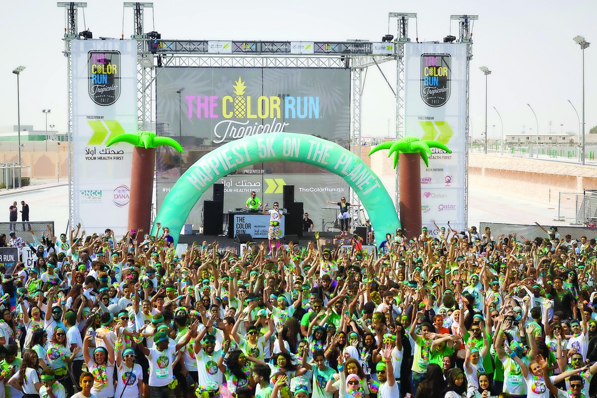 Participants in the third edition of The Color Run presented by Sahtak Awalan: Your Health First at the Qatar National Convention Centre in Doha as part of the Tropicolor World Tour.