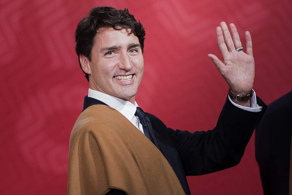 (FILES) This file photo taken on November 20, 2016 shows Canada's Prime Minister Justin Trudeau waving during the traditional 