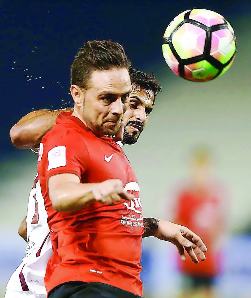 Al Rayyan’s Spanish striker Sergio Garcia (front) heads the ball during their Qatar Stas League match against El Jaish at Al Sadd Stadium in this October 2016 file picture.