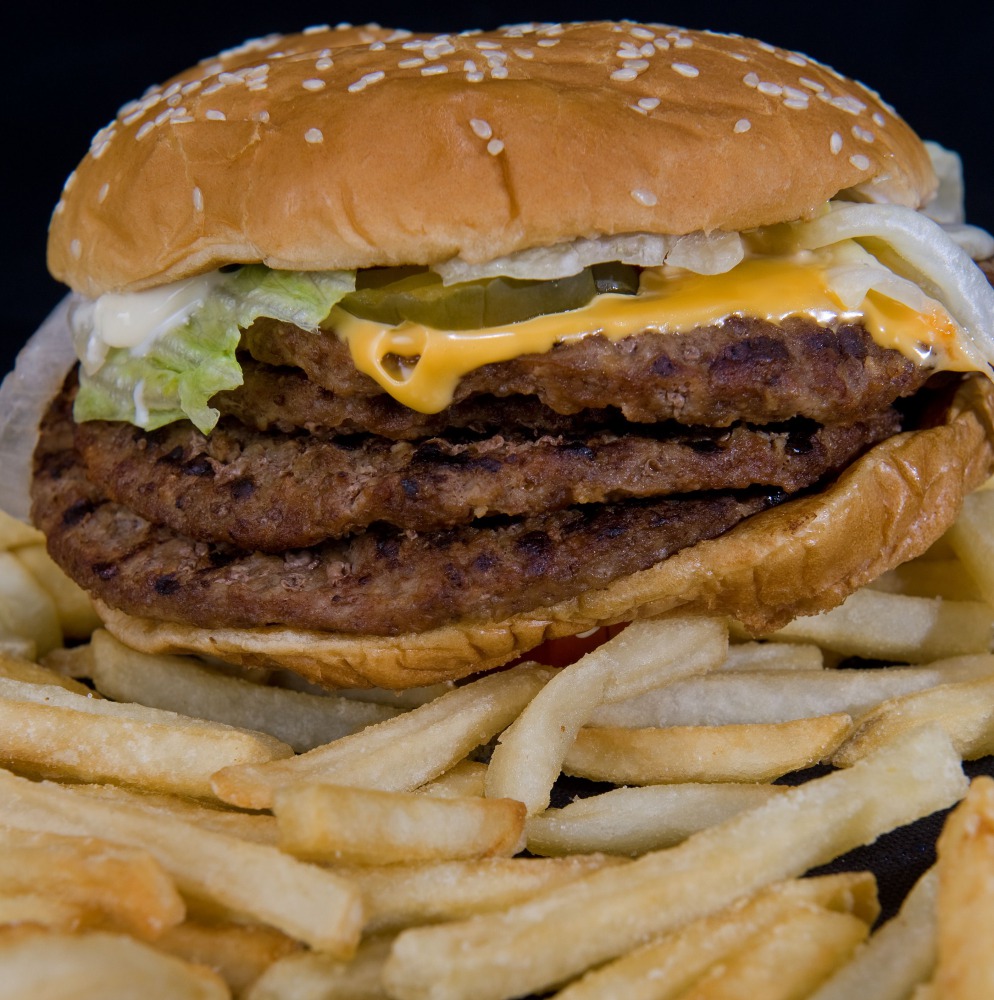 This file photo taken on August 19, 2009 shows a fast food hamburger in Washington, DC. Burgers, fries, tacos and pastries come wrapped in grease-proof paper and boxes that often contain non-stick chemicals that may be able to leach into food, US research