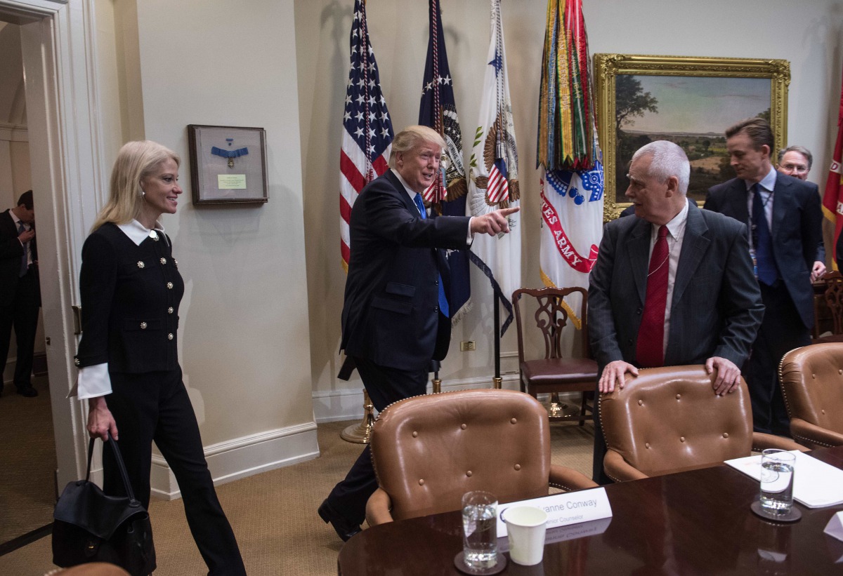 US President Donald Trump and Senior Counselor Kellyanne Conway (L) arrive for a meeting to discuss the nomination of Neil Gorsuch to the US Supreme Court in the Roosevelt Room at the White House in Washington, DC, on February 1, 2017. AFP / Nicholas Kamm