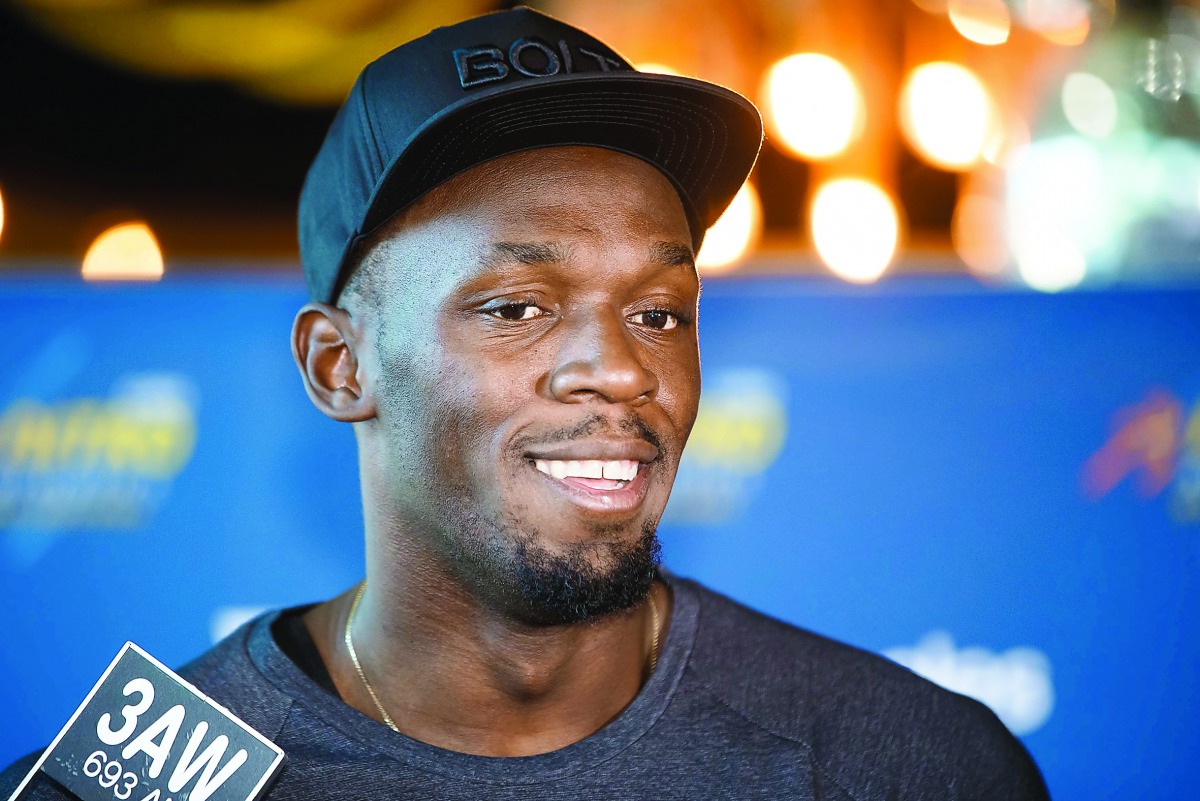 Olympic champion Usain Bolt speaks during a press conference in Melbourne yesterday. 