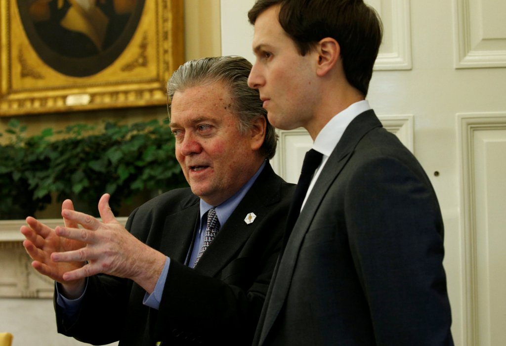 White House chief strategist Steve Bannon (L) and senior advisor Jared Kushner speak after U.S. President Donald Trump signed an executive order at the White House in Washington, U.S. February 3, 2017. REUTERS/Kevin Lamarque
