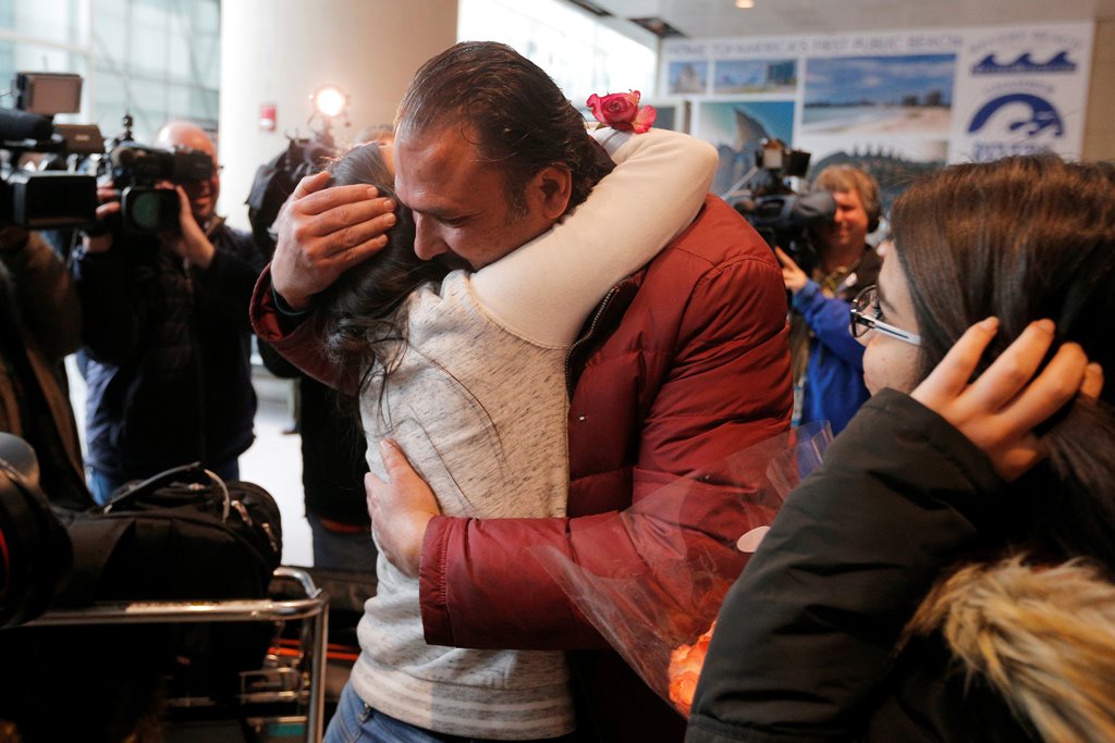 Banah Alhanfy is greeted by her uncle (R) at Logan Airport after she cleared US customs and immigration on special immigrant visa in Boston, Massachusetts, U.S. February 3, 2017. Reuters/Brian Snyder
