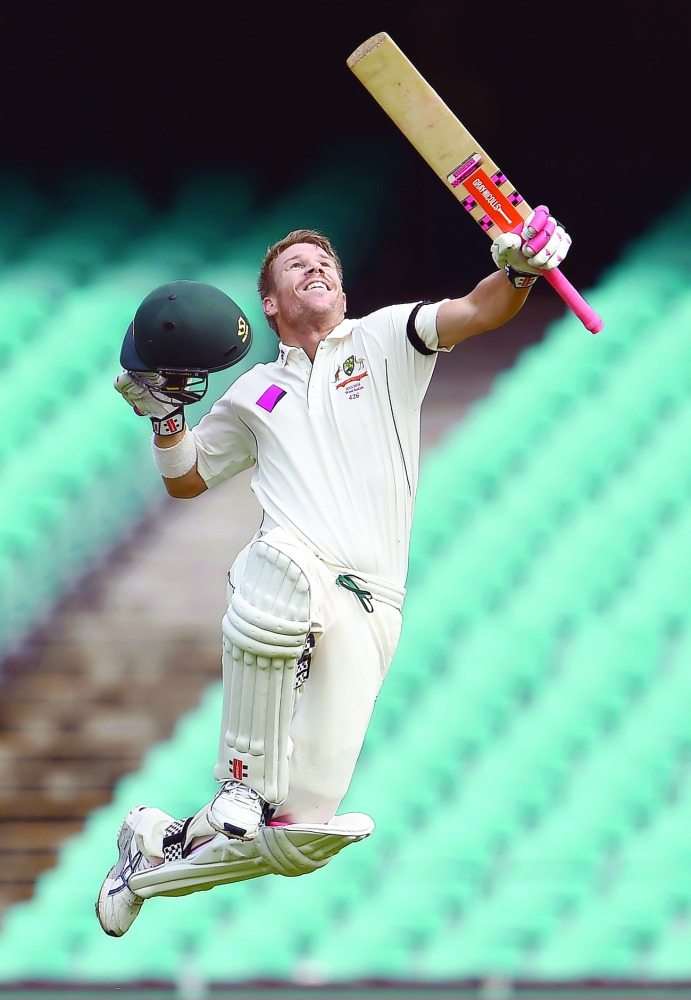 David Warner celebrating a century in this file photo. Australia sans Warner were beaten by New Zealand in one-day series and are set to suffer financial loss according to current pay system.   