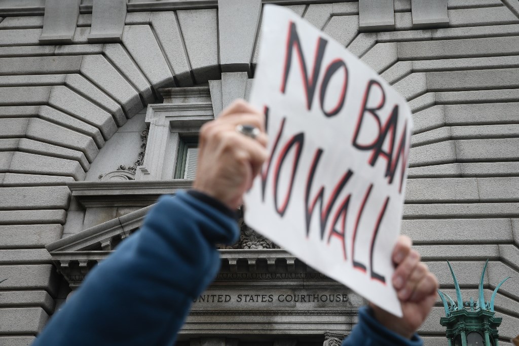 SAN FRANCISCO, CA - FEBRUARY 7: Opponents of U.S. President Donald Trump's executive order imposing a temporary immigration ban on seven Muslim-majority nations protest outside a federal appeals court February 7, 2016 in San Francisco, California. Elijah 
