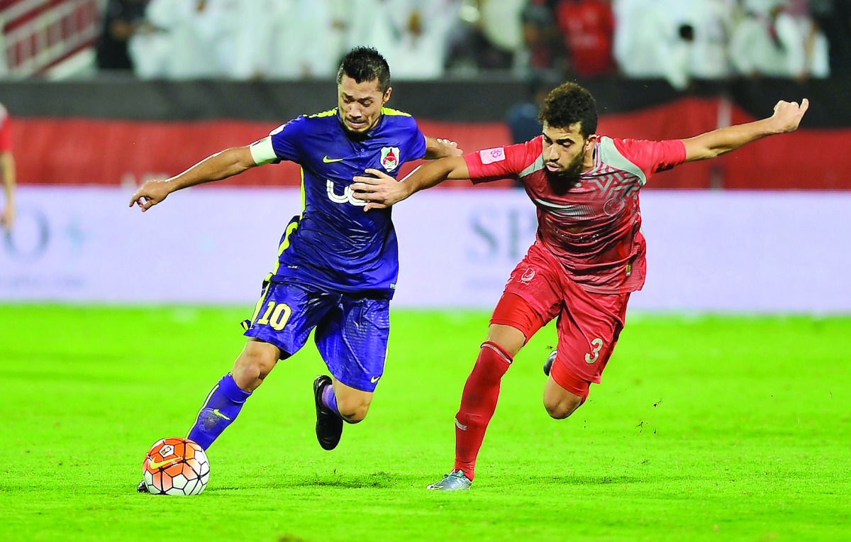 Al Rayyan’s Rodrigo Tabata (left) and Lekhwiya’s Ahmed Yasser Aziz vie for ball possession during their Qatar Star League (QSL) match at Lekhwiya Stadium in this November 2015 file photo.