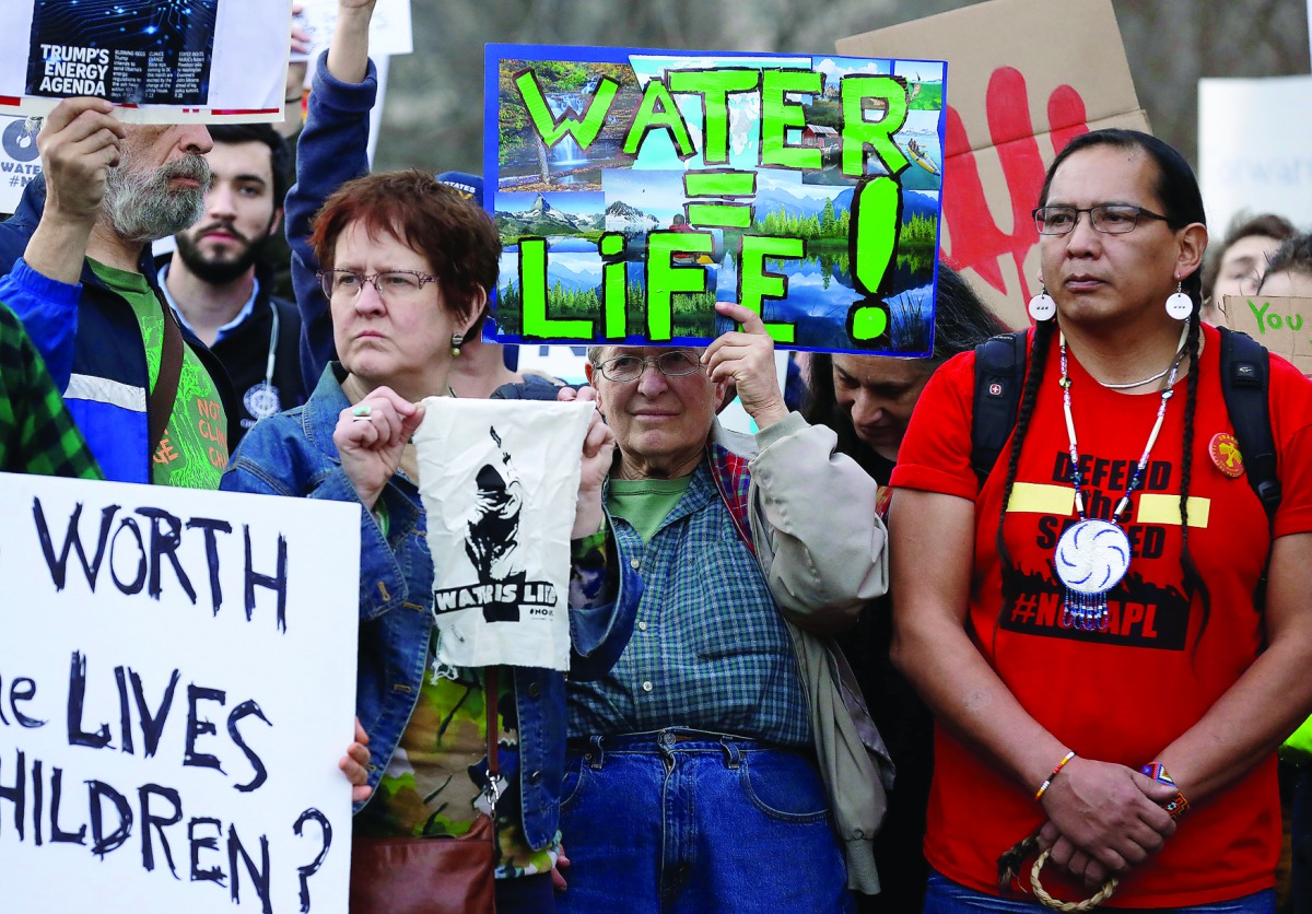 People protest against US President Donald Trump's directive to permit the Dakota Access Pipeline during a demonstration at the White House in Washington, yesterday.