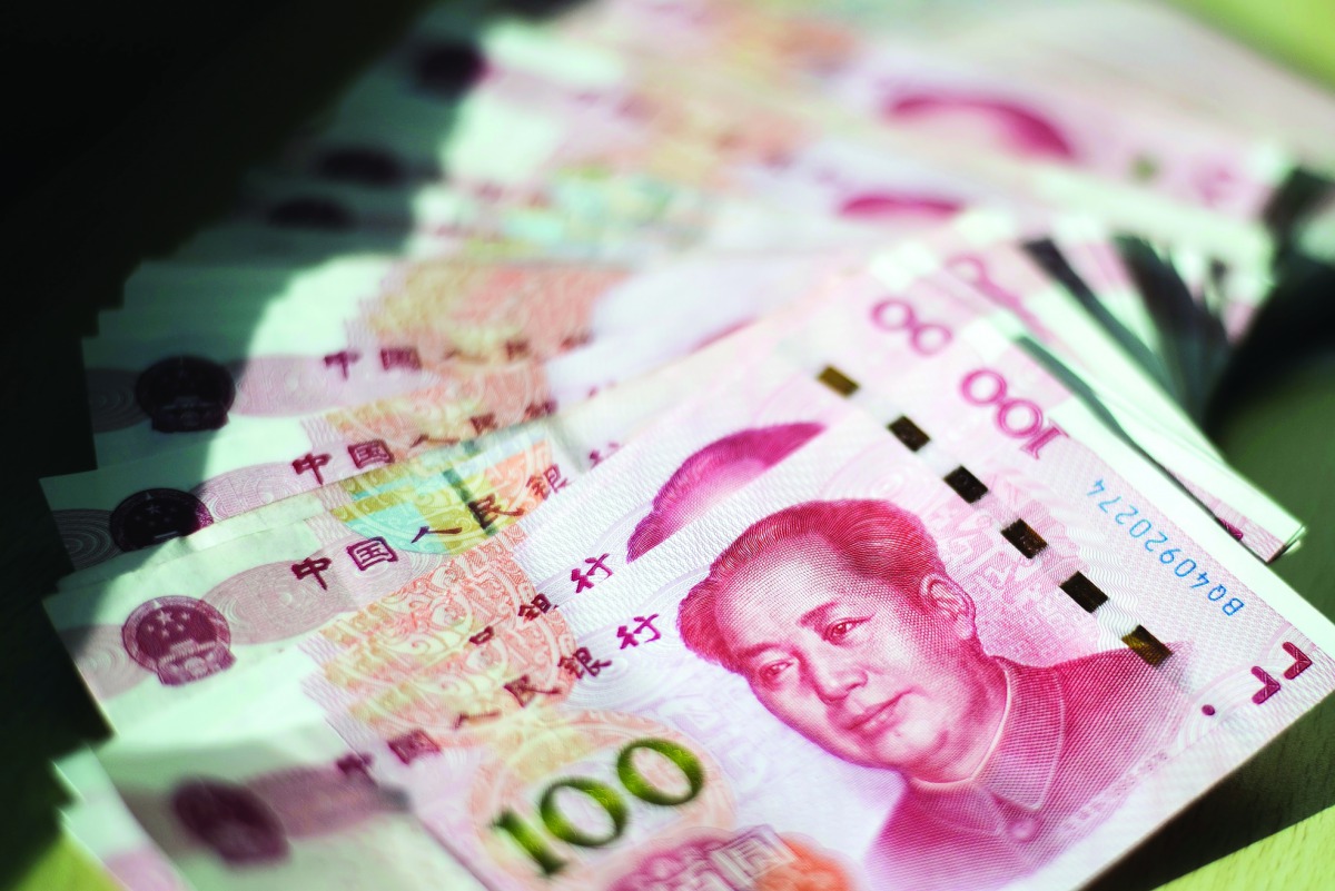 This photo illustration shows Chinese 100 yuan notes in Beijing.