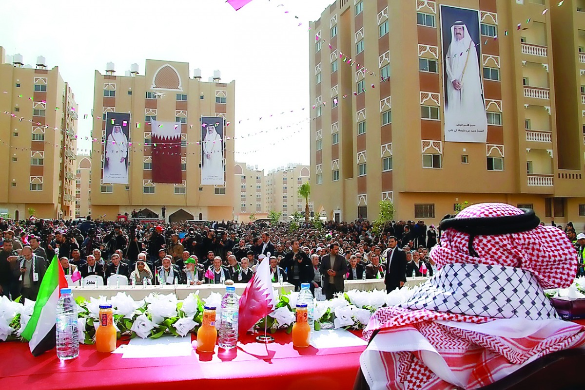 A ceremony being held for handing over flats of the second phase of the residential units of HH Sheikh Hamad bin Khalifa Al Thani City at Khan Younis in Southern Gaza Strip yesterday.