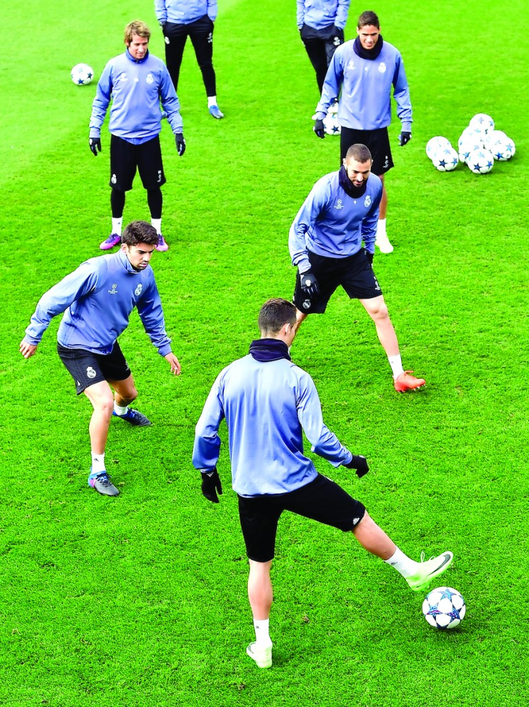 Real Madrid's players take part in a training session at Valdebebas training ground in Madrid yesterday, on the eve of the UEFA Champions League match against Napoli.