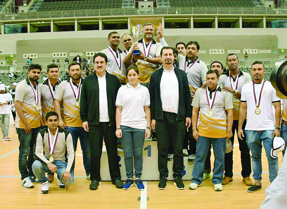 Winners of a group event pose for a photograph with officials of Alfardan Group during their National Sport Day celebrations at the Ali Bin Hamad Al Attiyah Arena on Tuesday.