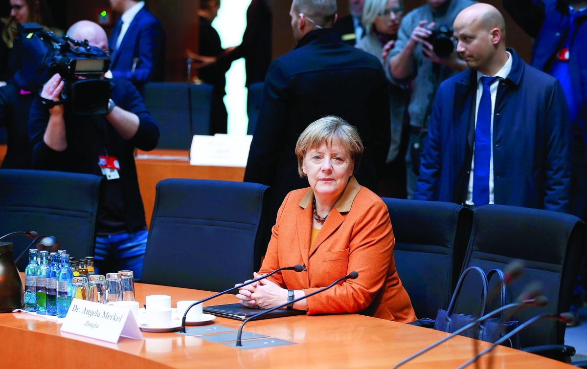 German Chancellor Angela Merkel sits in the witness stand of a parliamentary inquiry in Berlin investigating the NSA's activities in Germany, yesterday.