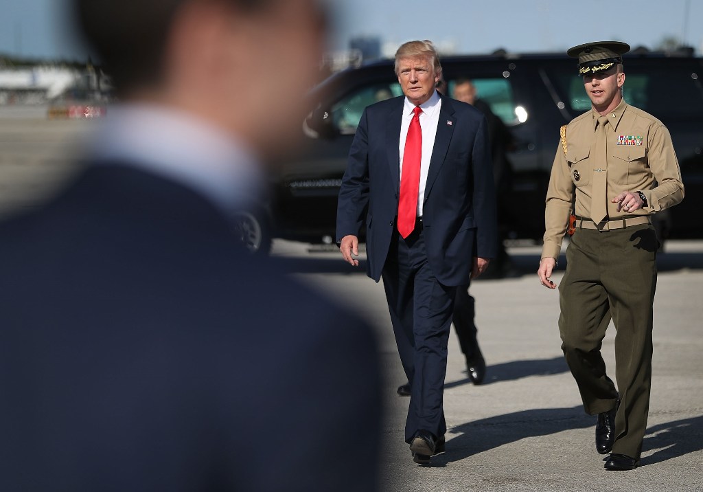 President Donald Trump walks to greet supporters after arriving on Air Force One at the Palm Beach International Airport to spend part of the weekend at Mar-a-Lago resort on February 17, 2017 in West Palm Beach, Florida. Joe Raedle/Getty Images/AFP
