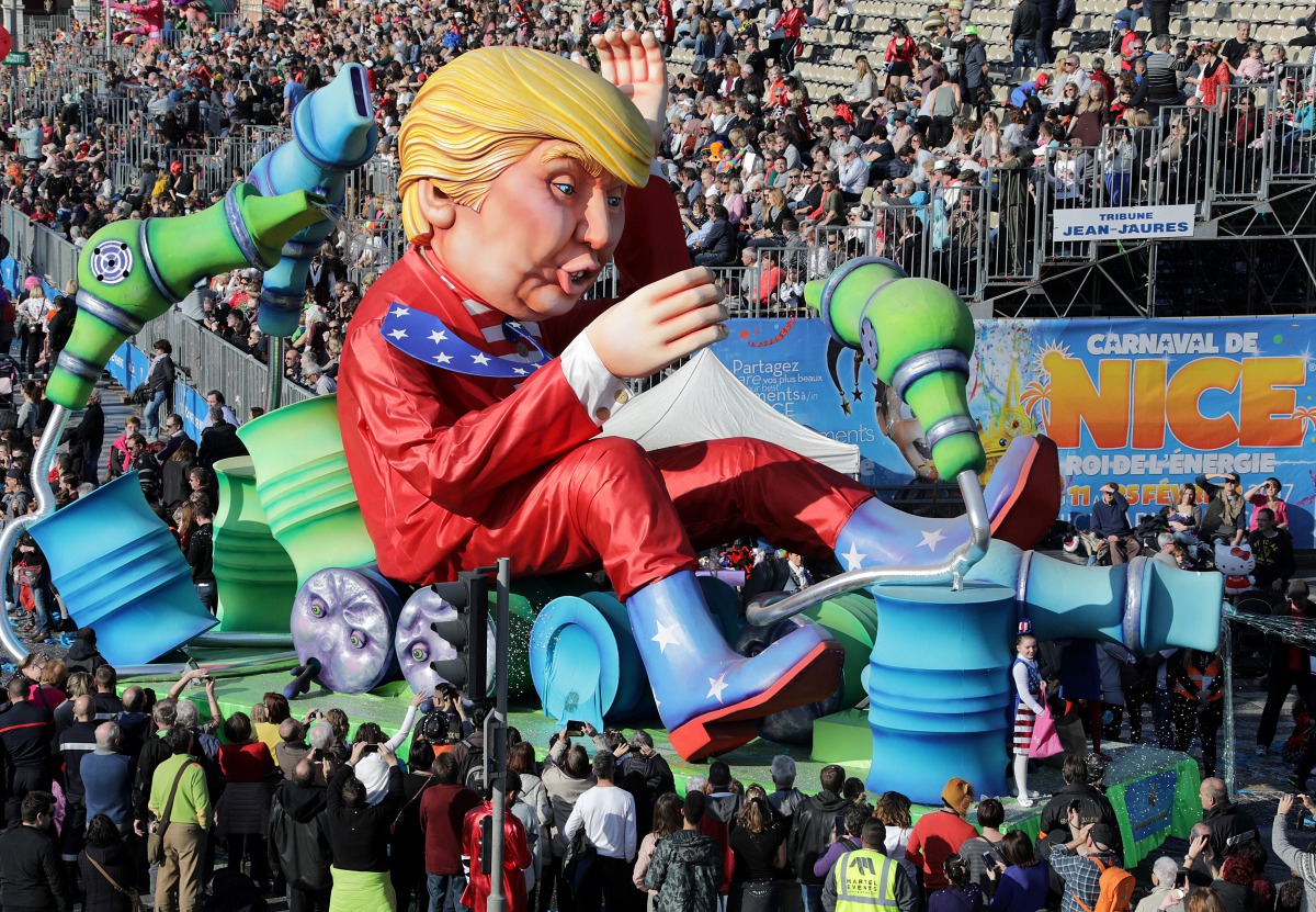 A float with a giant figure of U.S. President Donald Trump is paraded through the crowd during the 133rd Nice Carnival parade, the first major event since the city was attacked during Bastille Day celebrations last year in Nice, France, February 19, 2017.