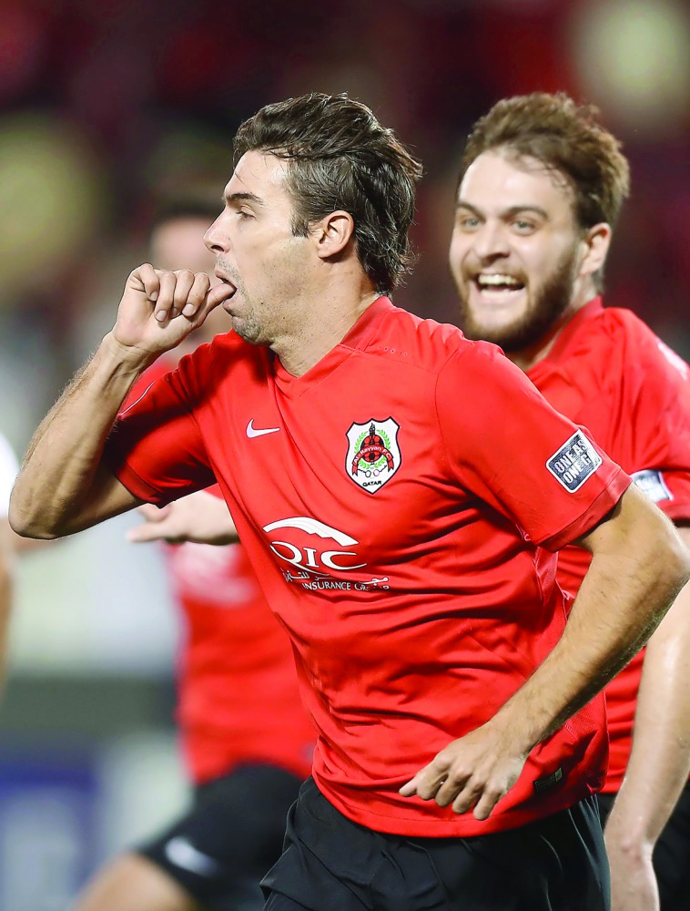 Al Rayyan's Gonzalo Viera celebrates after scoring a goal during the Asian Champions League play-off match against Al Wahda at the Jassim Bin Hamad Stadium in Doha yesterday. 