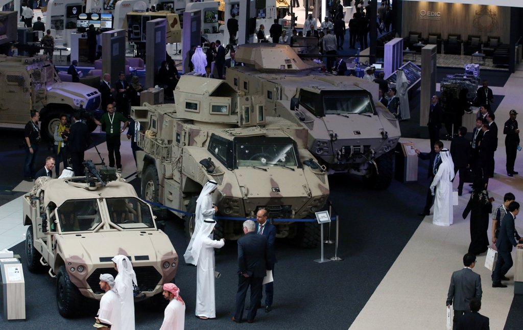 Visitors look at vehicles on display during the International Defence Exhibition and Conference (IDEX) in Abu Dhabi, United Arab Emirates February 19, 2017. REUTERS/Stringer
