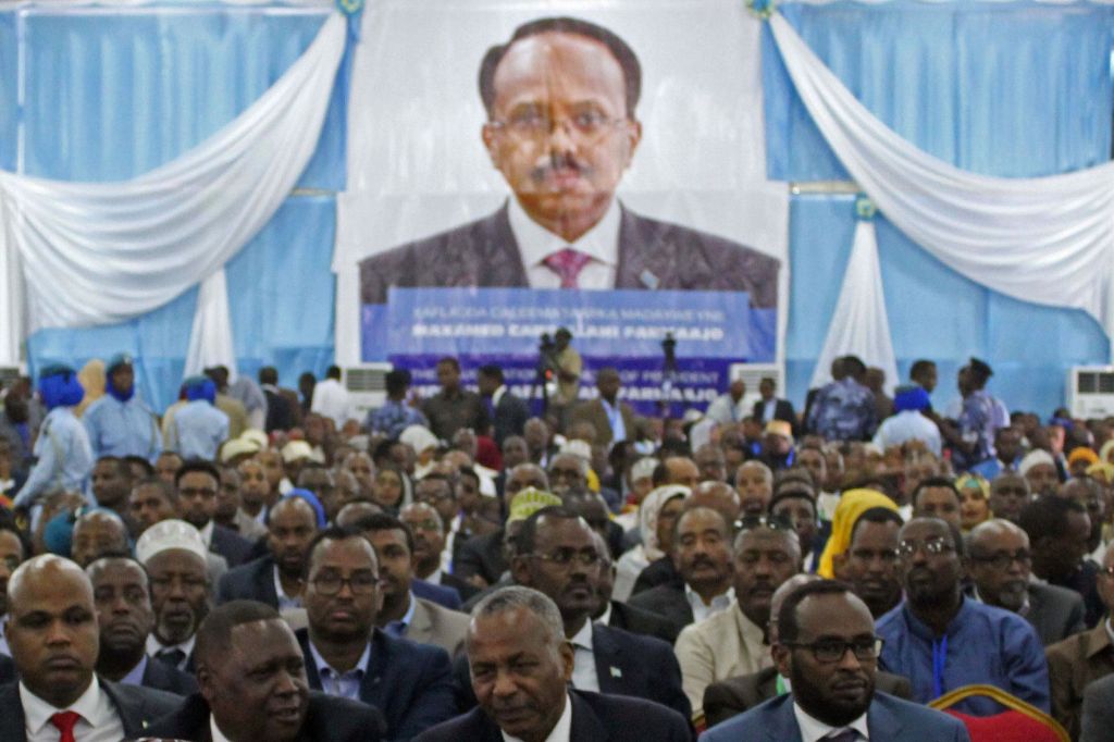 Delegates listen to Somalia's new President Mohamed Abdullahi Mohamed during his inauguration at Mogadishu airport on February 22, 2017. AFP / STRINGER
