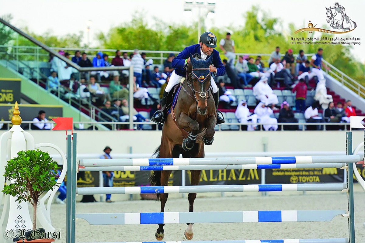 Ramzy Hamad Al Duhami guides Garlic VH Kapelhof  over an obstacle during the CSI5* 150cm event of the H H The Emir’s Sword International Showjumping Championship at Qatar Equestrian Federation’s outdoor arena yesterday. Picture: Lotfi Garsi