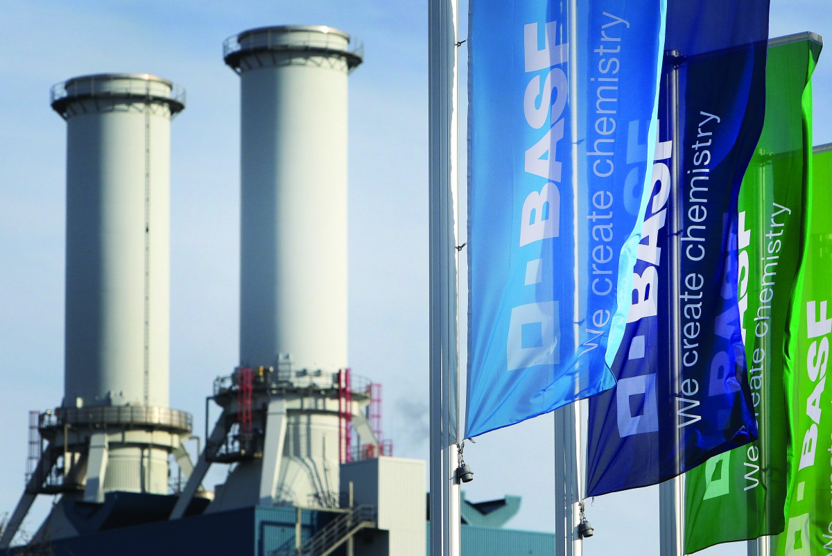 Flags with the logo of German chemicals company BASF flutter in front of the headquarters in Ludwigshafen, Germany.