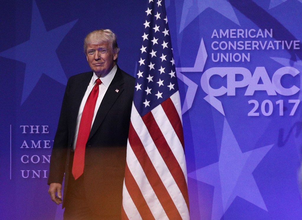 U.S. President Donald Trump walks on stage prior to his address to the Conservative Political Action Conference at the Gaylord National Resort and Convention Center February 24, 2017 in National Harbor, Maryland.  Alex Wong/AFP
