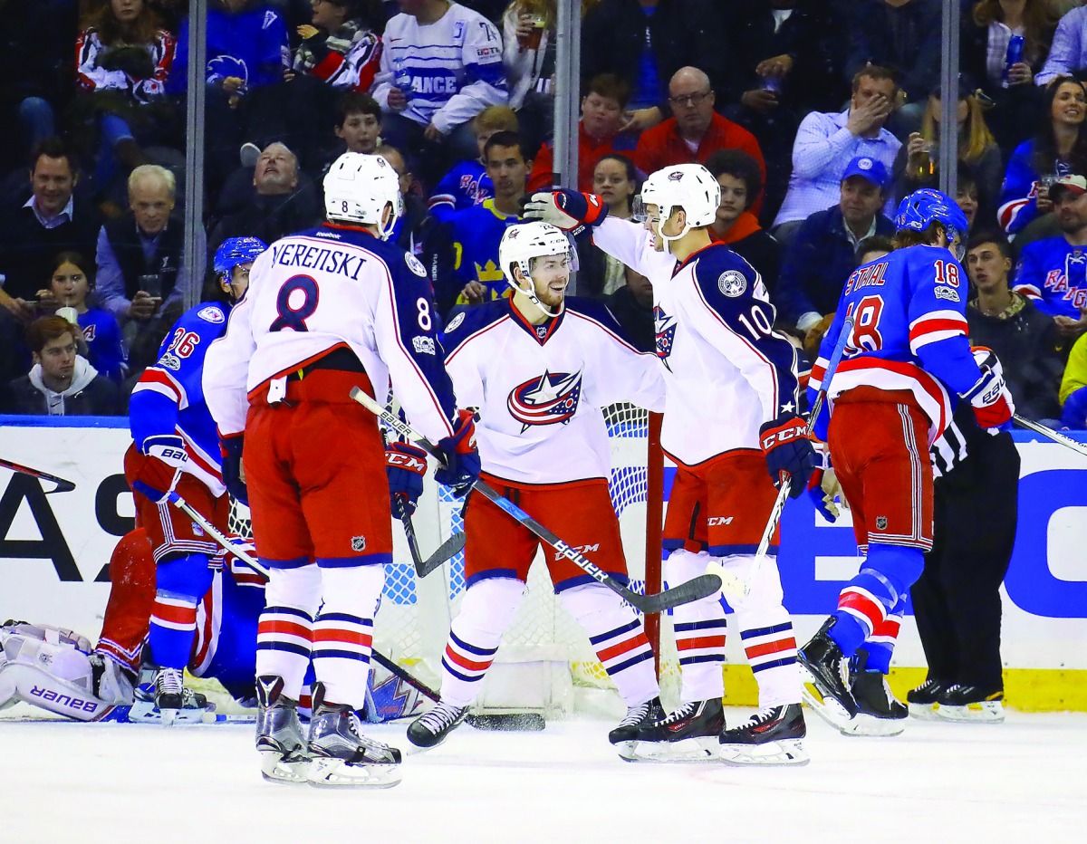 Columbus Blue Jackets' players celebrate a goal against the New York Rangers during their NHL game at Madison Square Garden in New York on Sunday.