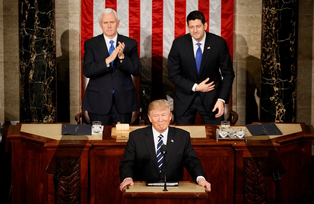 US President Trump addresses Joint Session of Congress - Washington, U.S. - 28/02/17 - US President Donald Trump pauses as he speaks in front of Vice President Mike Pence (L) and Speaker of the House Paul Ryan. Reuters/Jim Bourg