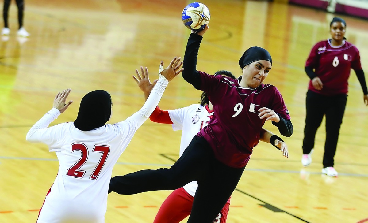 Hosts Qatar’s women handball team in action against Bahrain in the fifth GCC Women Games at Aspire Zone in Doha on Tuesday.