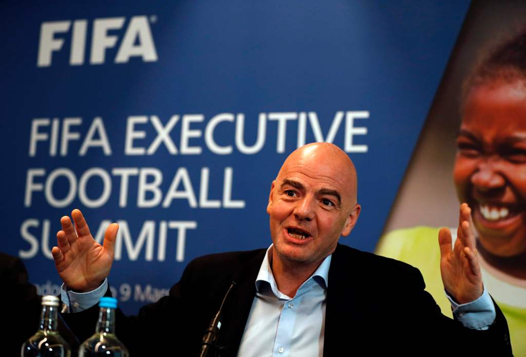 FIFA President Gianni Infantino gestures while talking with journalists during a press conference following the FIFA Executive Football Summit near Heathrow airport in London on March 9, 2017.   AFP / ADRIAN DENNIS
