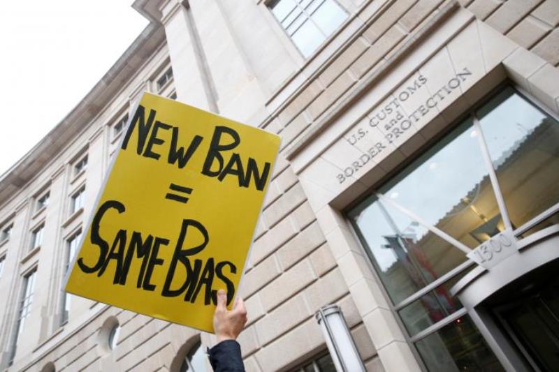 Immigration activists, including members of the DC Justice for Muslims Coalition, rally against the Trump administration's new ban against travelers from six Muslim-majority nations, outside of the U.S. Customs and Border Protection headquarters in Washin