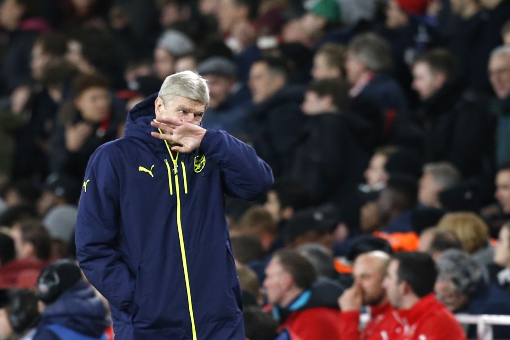 Arsenal's French manager Arsene Wenger reacts during the UEFA Champions League last 16 second leg football match between Arsenal and Bayern Munich at The Emirates Stadium in London on March 7, 2017. / AFP / IKIMAGES / Ian KINGTON
