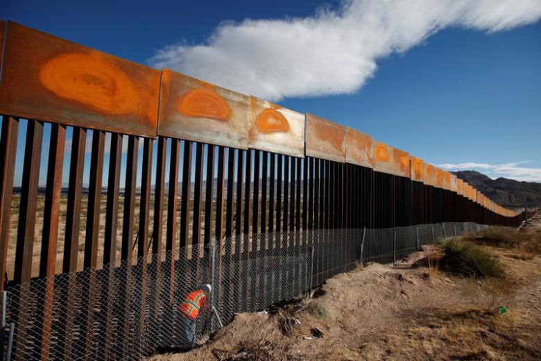 A US worker inspects a section of the US-Mexico border wall at Sunland Park, US opposite the Mexican border city of Ciudad Juarez, Mexico, November 9, 2016. Reuters/Jose Luis Gonzalez/File photo