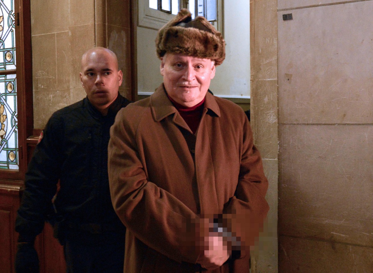 This file photo taken on December 9, 2013 shows International terrorist Ilich Ramirez Sanchez (R), aka Carlos, arriving at the Criminal Court of the Palais de Justice in Paris. Ilich Ramirez Sanchez, a figure of international terrorism in the 70s and 80s,