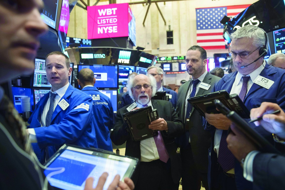 Traders work on the floor of the New York Stock Exchange.