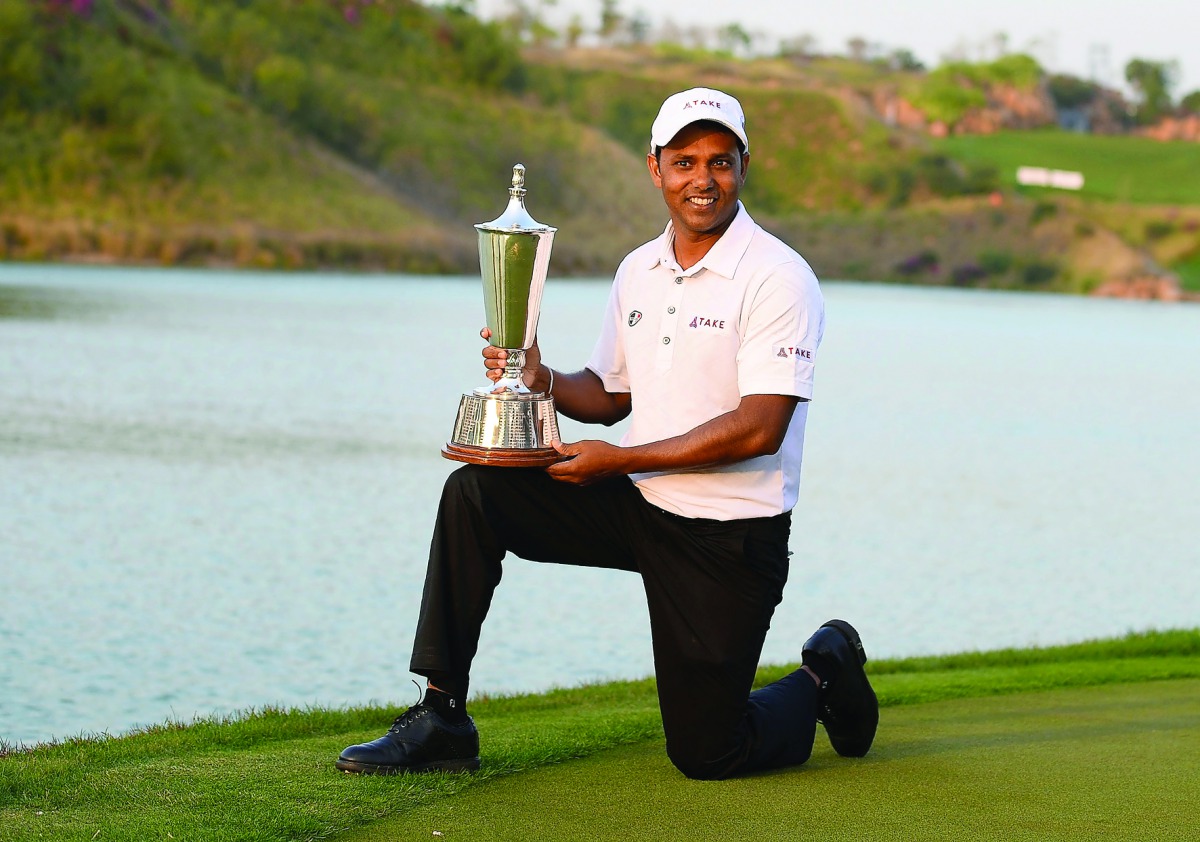 Indian golfer SSP Chawrasia poses with the trophy after he won the Hero Indian Open golf tournament at the Dlf Golf and Country Club in Gurgaon, yesterday.
