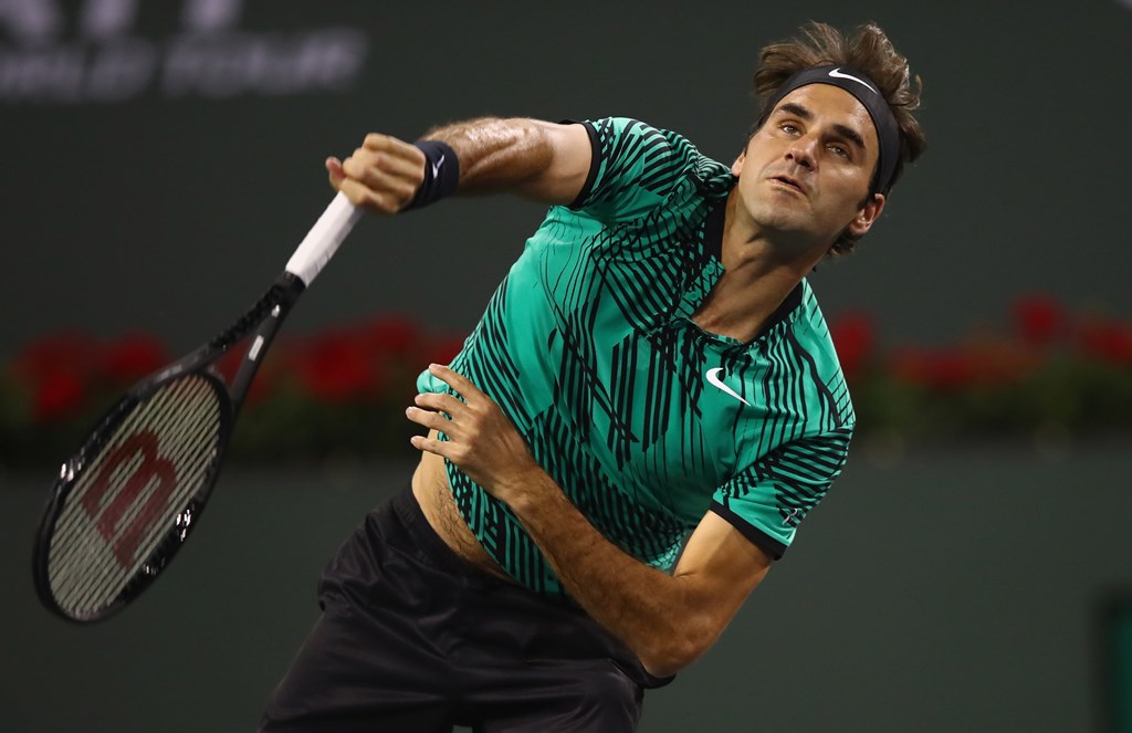 Roger Federer of Switzerland serves during his straight sets victory against Stephane Robert of France in their second round match during day seven of the BNP Paribas Open at Indian Wells Tennis Garden on March 12, 2017 in Indian Wells, California. Clive 