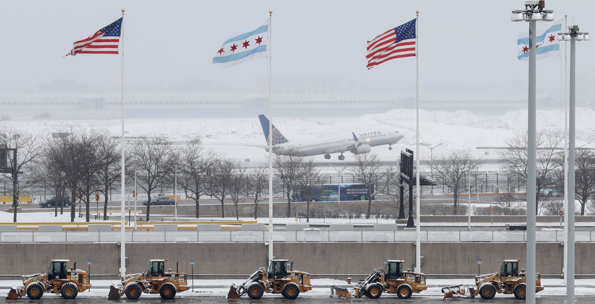 An United Airlines plane departs during a snowstorm at O'Hare International Airport in Chicago, Illinois, U.S., March 13, 2017. REUTERS/Kamil Krzaczynski 