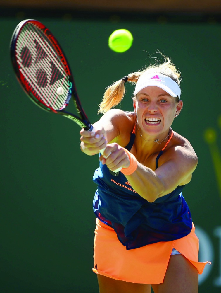 Angelique Kerber of Germany plays a backhand shot against Pauline Parmentier of France in their third round match during day eight of the BNP Paribas Open at Indian Wells Tennis Garden on Monday. 