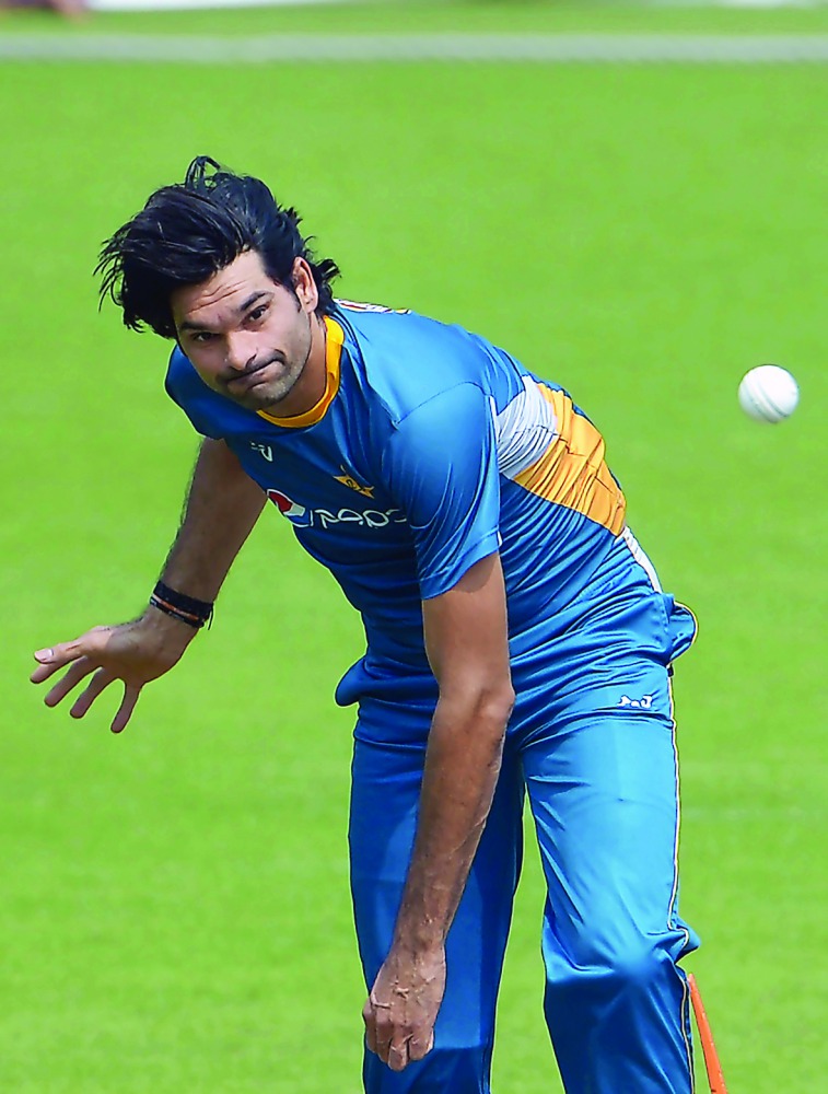 In this photograph taken on March 13, 2016, Pakistan's Mohammad Irfan delivers a ball as he takes part in a training session ahead of the World T20 cricket tournament match at The Eden Gardens Cricket Stadium in Kolkata.