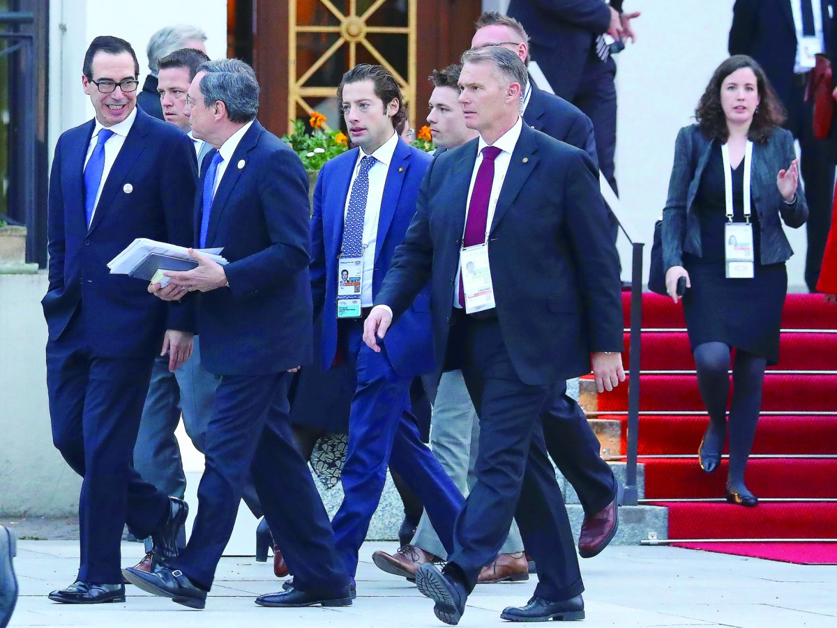  The President of the European Central Bank (ECB) Mario Draghi walks together with US Treasury Secretary Steven Mnuchin (left) during the G20 Finance Ministers and Central Bank Governors Meeting in Baden-Baden, Germany.