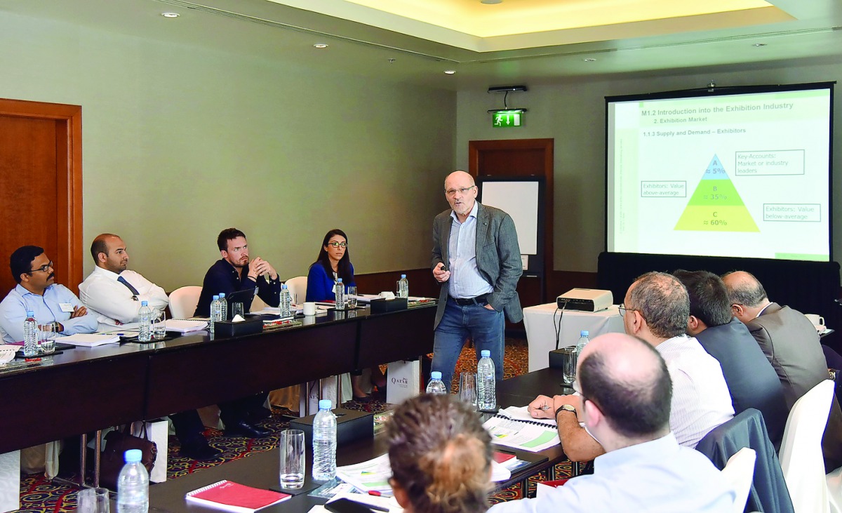 Participants attending a session on event management.